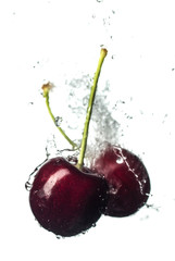 Fototapeta na wymiar Fresh and juicy cherry fruit served in a splash of water