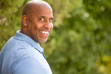 Mature African American man smiling.