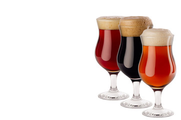 Set  of different beer in wineglasses with foam - lager, red ale, porter -  isolated on white background.