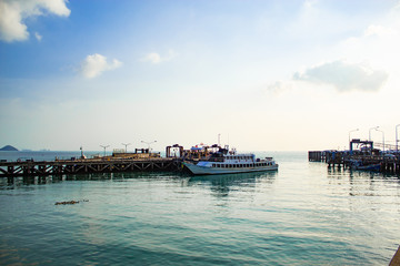 Fototapeta premium The fishing pier and ferry boats. On the island.
