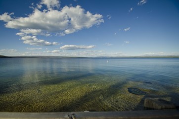 A long bueatiful view of the lake at yellowstone in the amazing summer time sun. 