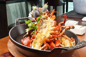 Delicious roasted lobster dinner with  fresh herbs
