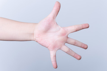 hands of the child isolated on the white background.