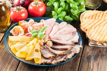 Cold meat platter with ham, prosciutto, bacon and cheese