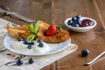 Pancakes with jam and berries