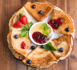 Pancakes with jam and berries
