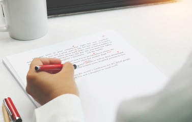 proofreading paper on table