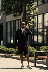 Fashionable african american man listening to music