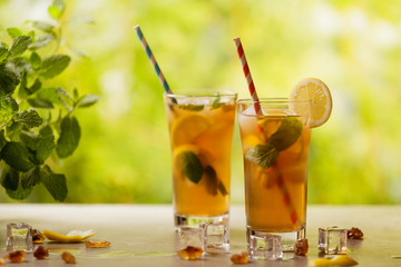 Iced tea with lemon and ice cubes