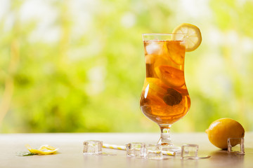 Iced tea with lemon and ice cubes