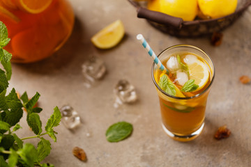 Iced tea with lemon and ice cubes
