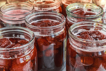 Fototapeta na wymiar Strawberry jam in glass jars