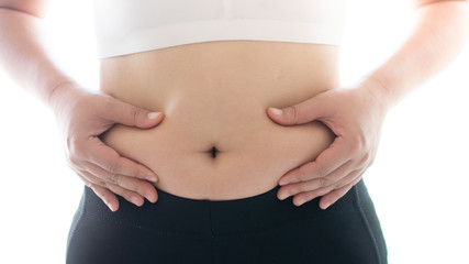 Belly fat in women and fat woman touching her stomach