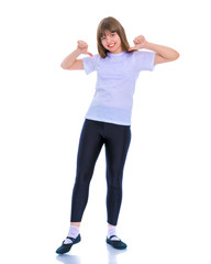 Little school girl pointing to her empty white t-shirt.