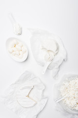 top view of various milk products on white surface