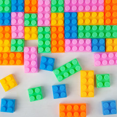 Colourful plastic construction blocks. Top view