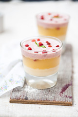 Panna cotta in layers with vanilla and strawberries