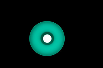 Electric green lamp with led bulb on black background