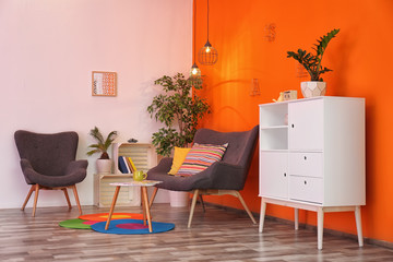 Interior of modern living room with pillows on sofa