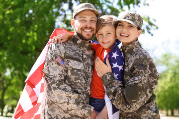 Fototapeta na wymiar Happy military family with their son outdoors