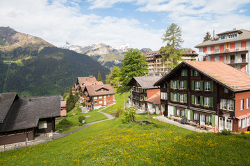 Fototapeta na wymiar Houses in the highlands of Wengen village in Switzerland