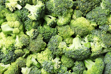 Fresh green broccoli as background, top view