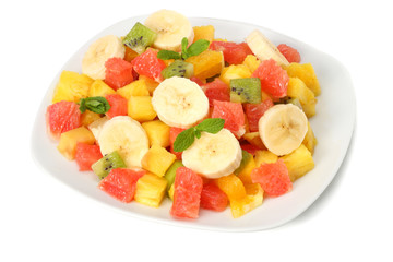 Bowl of healthy citrus fruit salad isolated on white background