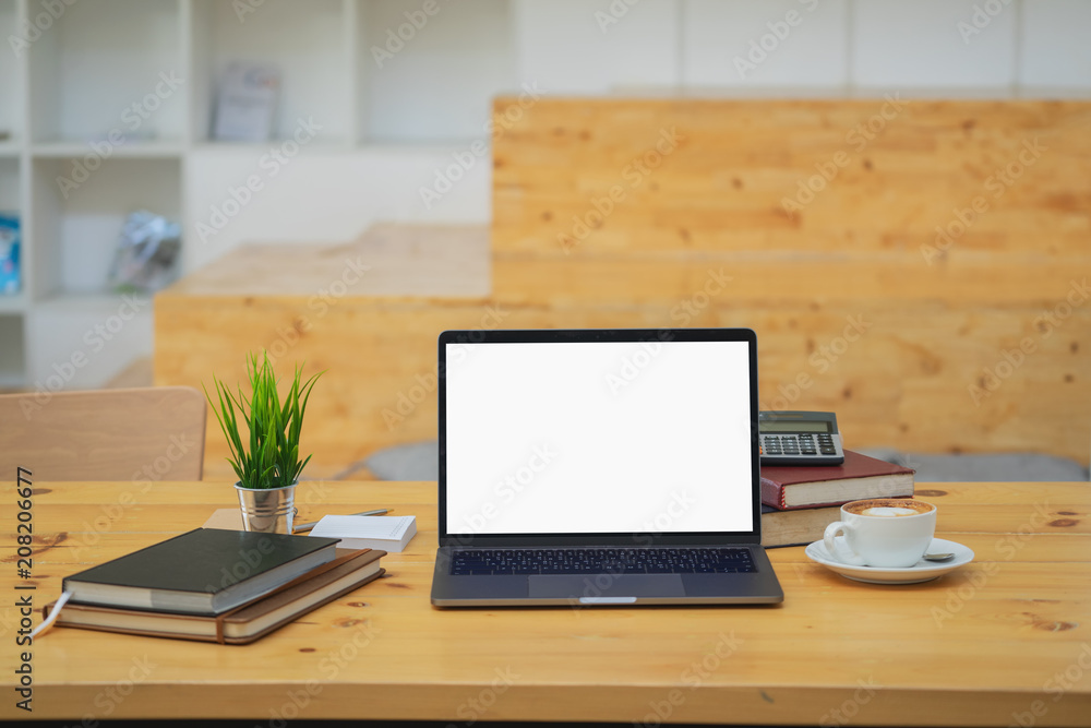 Poster mock up : workspace with blank white laptop computer, pencils and stationery items. blank screen for