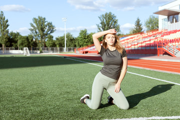 Portrait of a young woman in sports uniform.