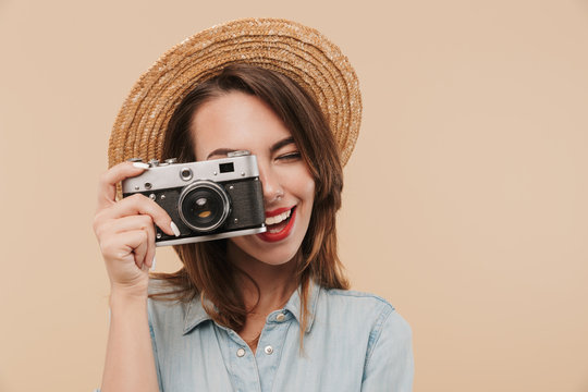 Portrait of a happy young girl taking a picture