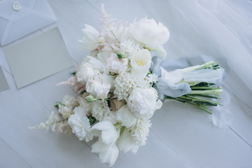 top view of beautiful bridal bouquet on white wooden floor