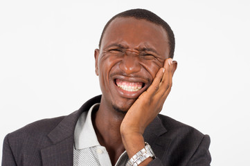 young man in suit standing on white background, suffering.
