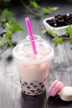 Strawberry Boba Bubble Tea with fruits and crushed ice.