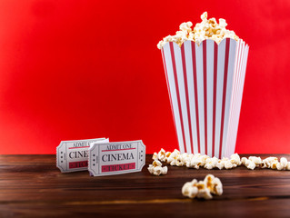 Obraz premium Popcorn With Two Red Movie Tickets