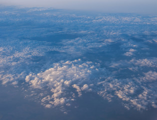Evening sunset sky from the window of the airplane.  View of the beautiful sky and clouds from the window of the airplane. 