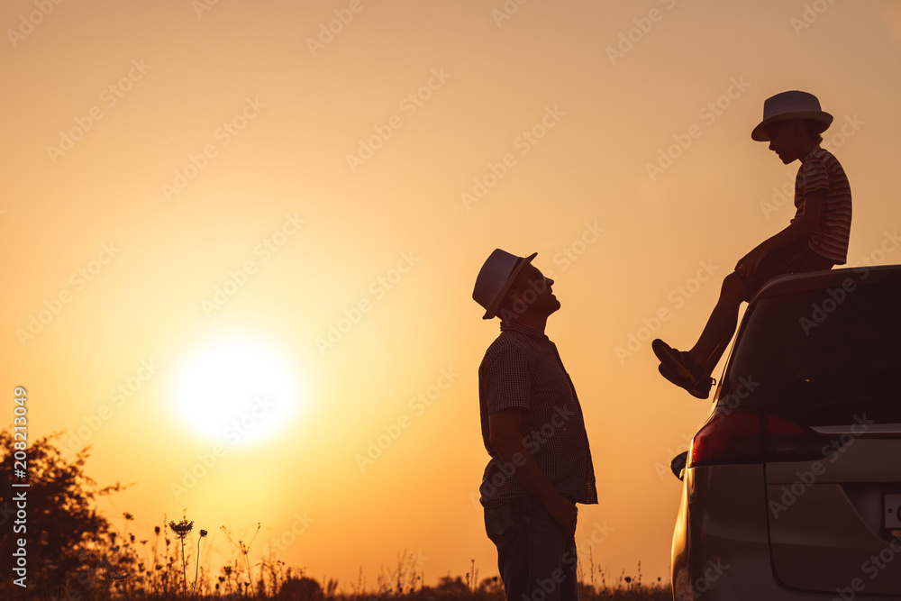 Canvas Prints father and son playing in the park at the sunset time.