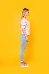Full size fullbody profile side view portrait of charming pretty girl wearing pants shoes isolated...