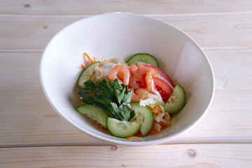 Salad with shrimps, tomato, cucumber and mayonnaise
