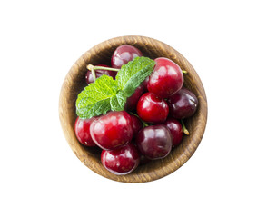 Fresh red cherries lay on white isolated background with copy space. Background of cherries. Cherries with copy space for text. Top view.