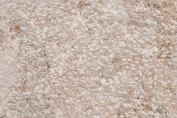 Texture. Fragment of a wall of an old granite stone