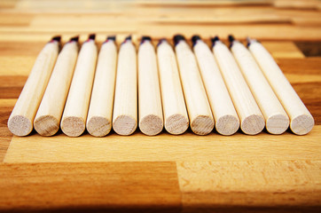 a set of different tools for cutting wood products, with a wooden handle on a wooden Board background