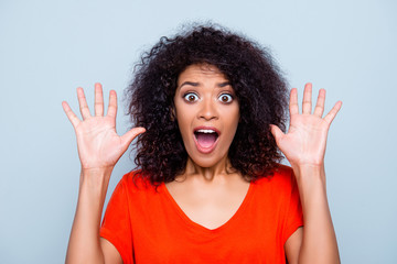 Give up! Portrait of stressed scared woman yelling with wide open mouth eyes showing two raised palms wearing vivid outfit isolated on grey background