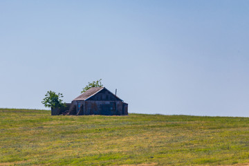 Old abandoned house or chalet lodge in steppe