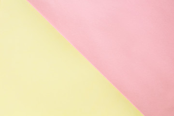 Abstract geometric water color paper background in soft pastel pink and yellow trend colors.