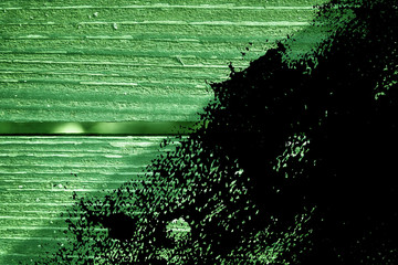 Grunge Golden lime colored Texture of old, shabby, green paint on an old wooden bench