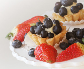 Tartlet with blueberries on white plate