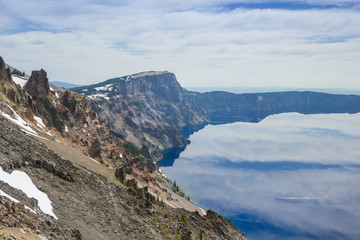 Beautiful scenery of the volcanic shoreline as seen from the east rim in Crater Lake, Oregon, USA