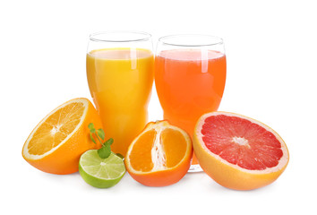 Glasses with delicious citrus juice and fresh fruits on white background