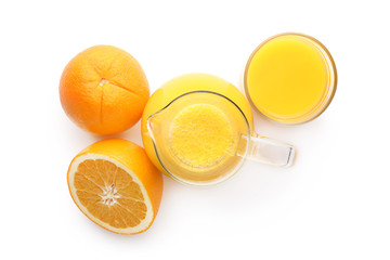Glassware with delicious citrus juice and fresh fruits on white background