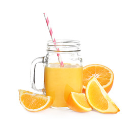 Mason jar with delicious citrus juice and fresh oranges on white background